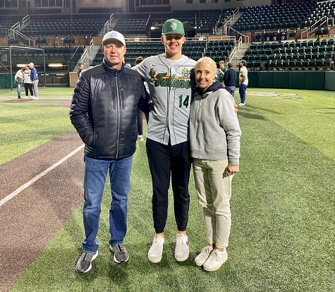 Cleavinger, son Grant and Rob's wife Amy pose on the field of Greer Field at Turchin Stadium, Tulane University